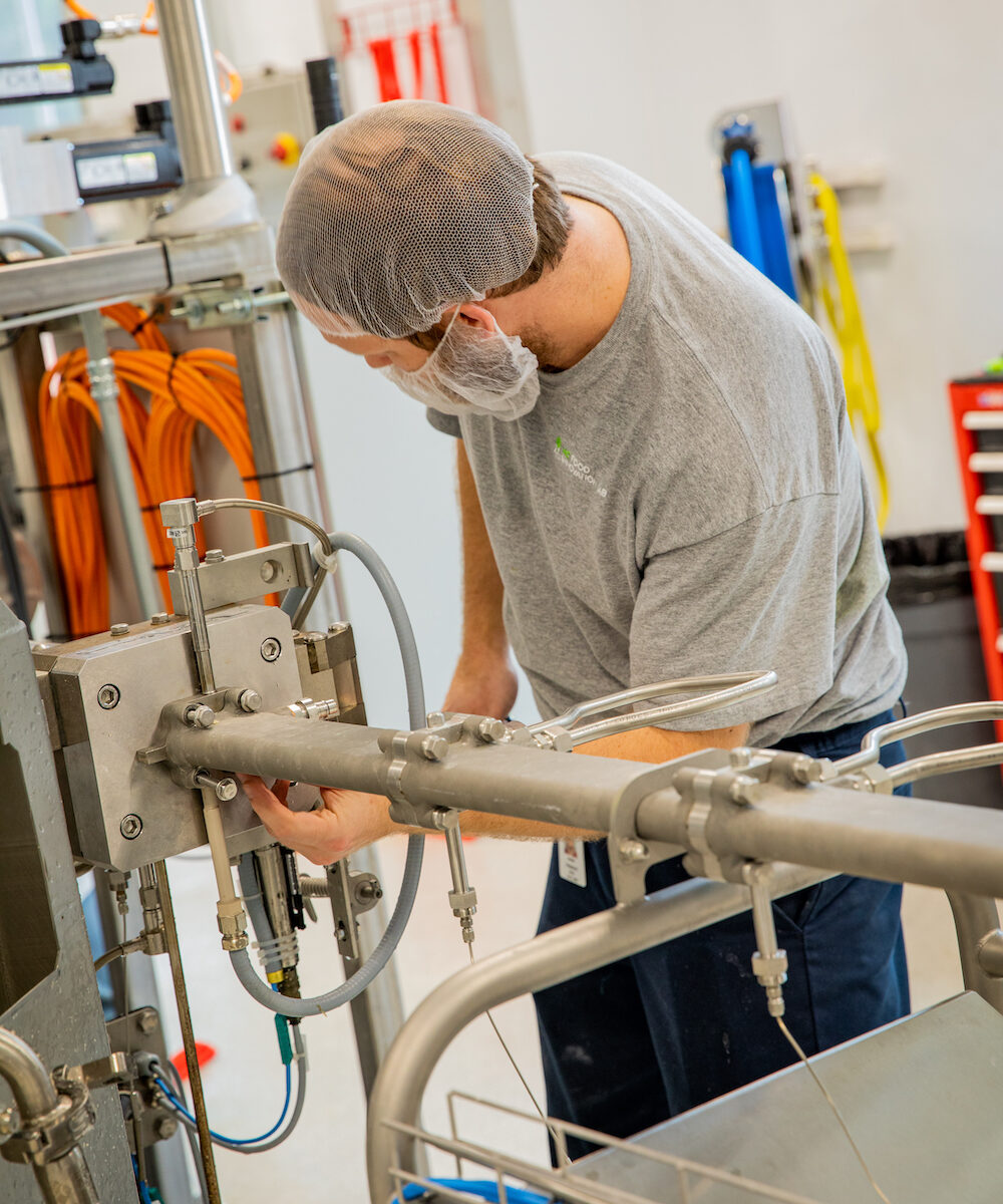 a man checks equipment at the North Carolina Food Innovation Lab