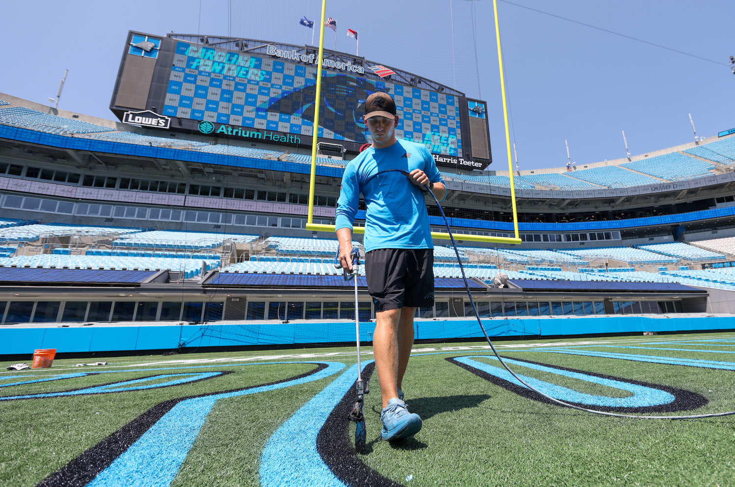 man painting endzone