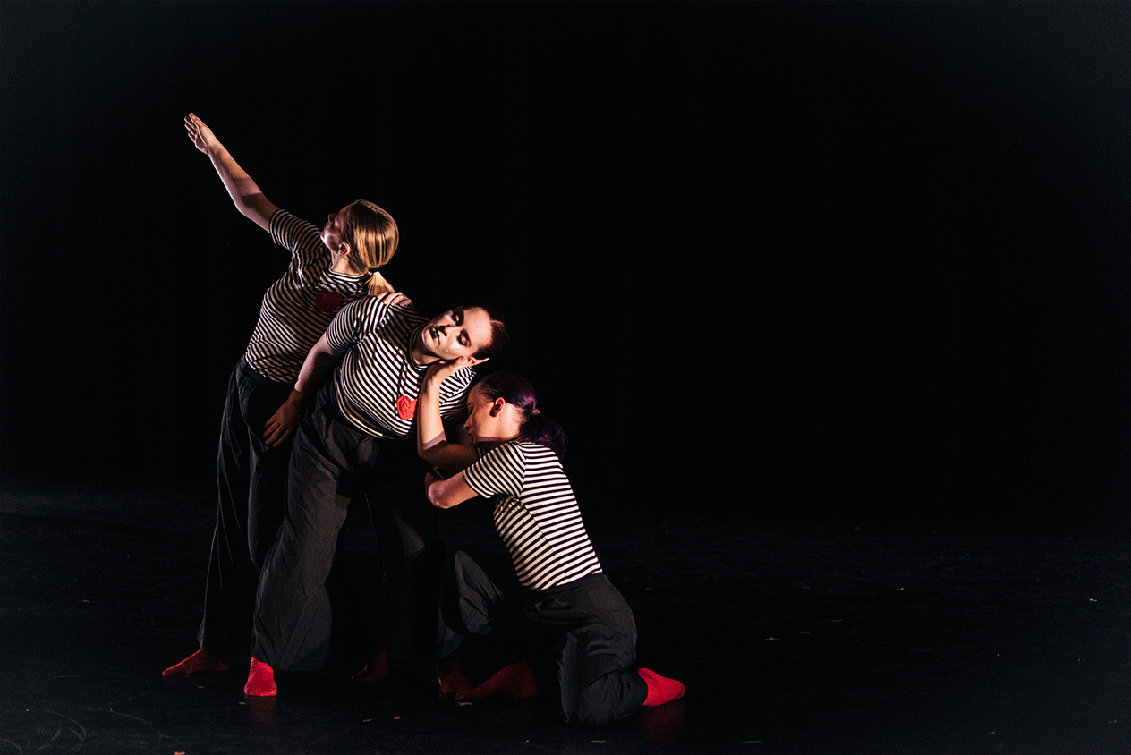 three dancers in mime costumes