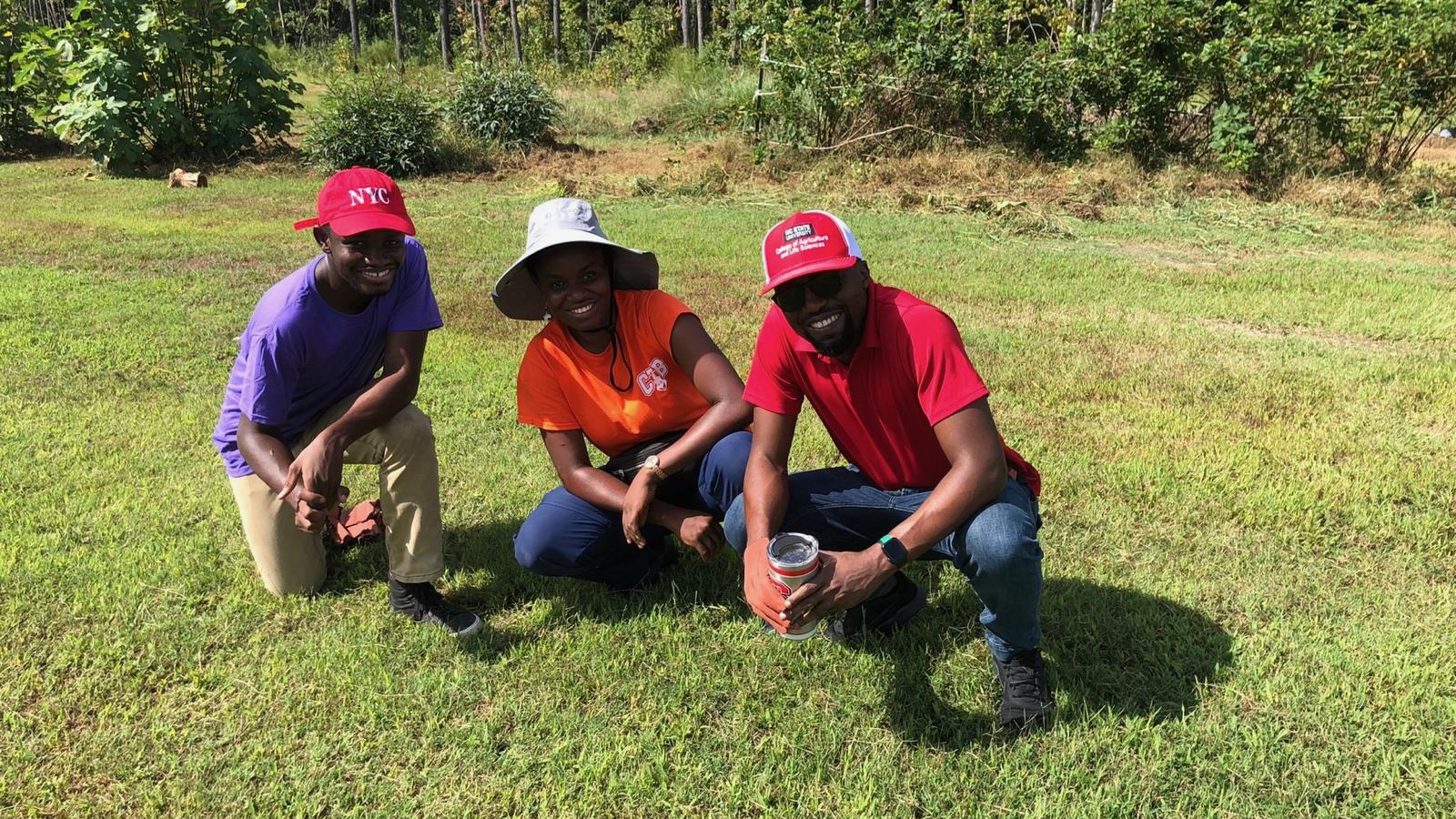 three people on a farm