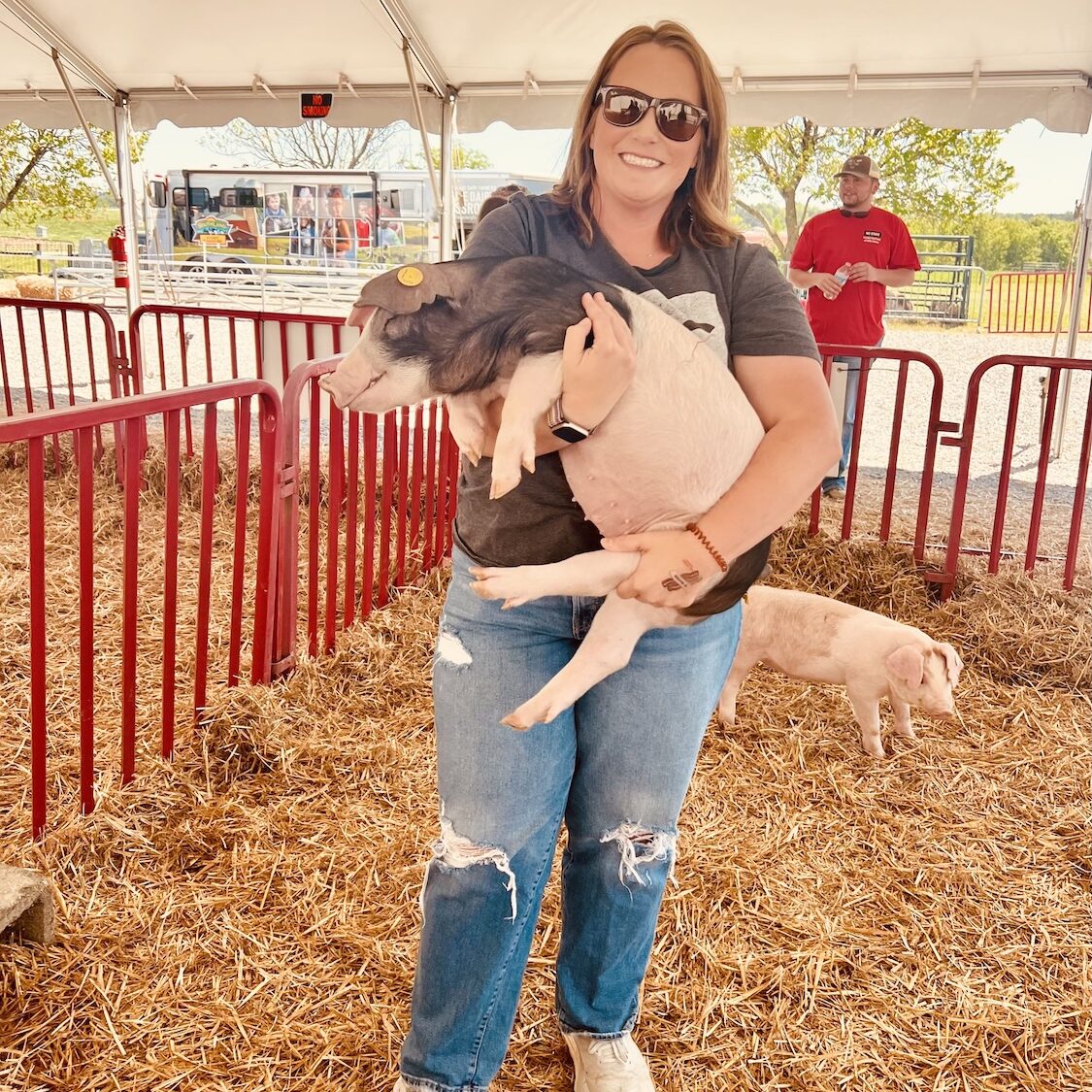 Woman holding pig