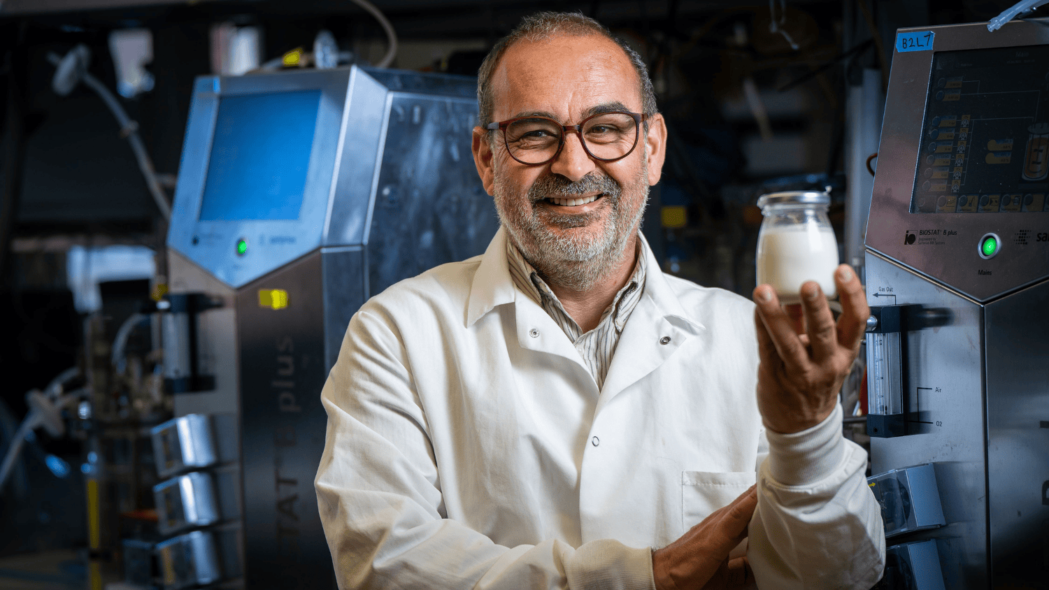 Jose Bruno-Barcena holding lab-made yogurt
